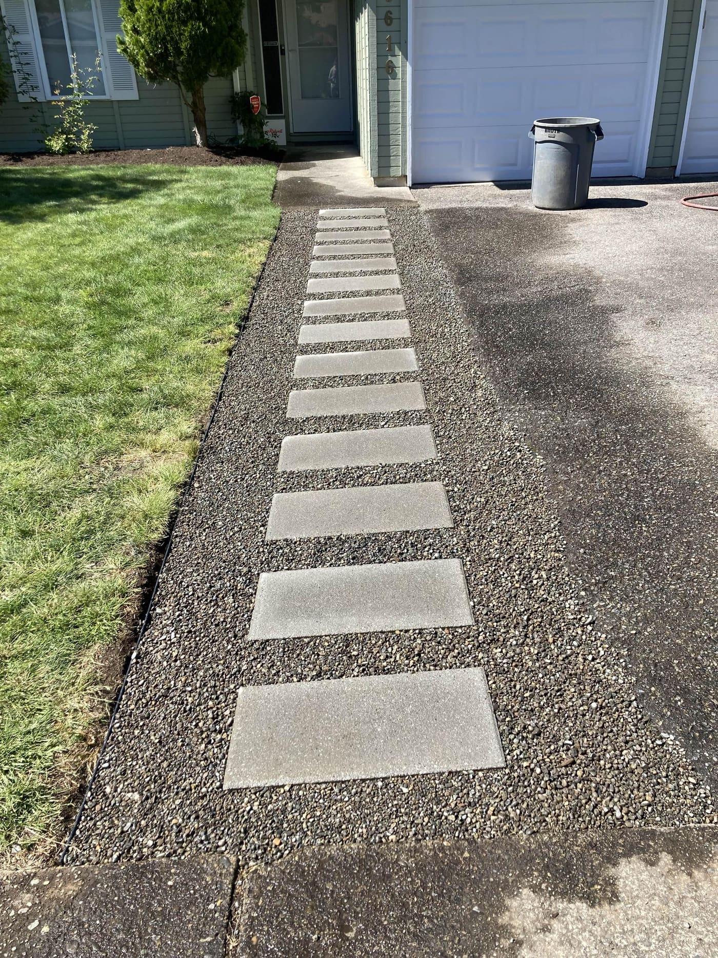 Stepping stone pathway along a residential driveway in Greater Seattle