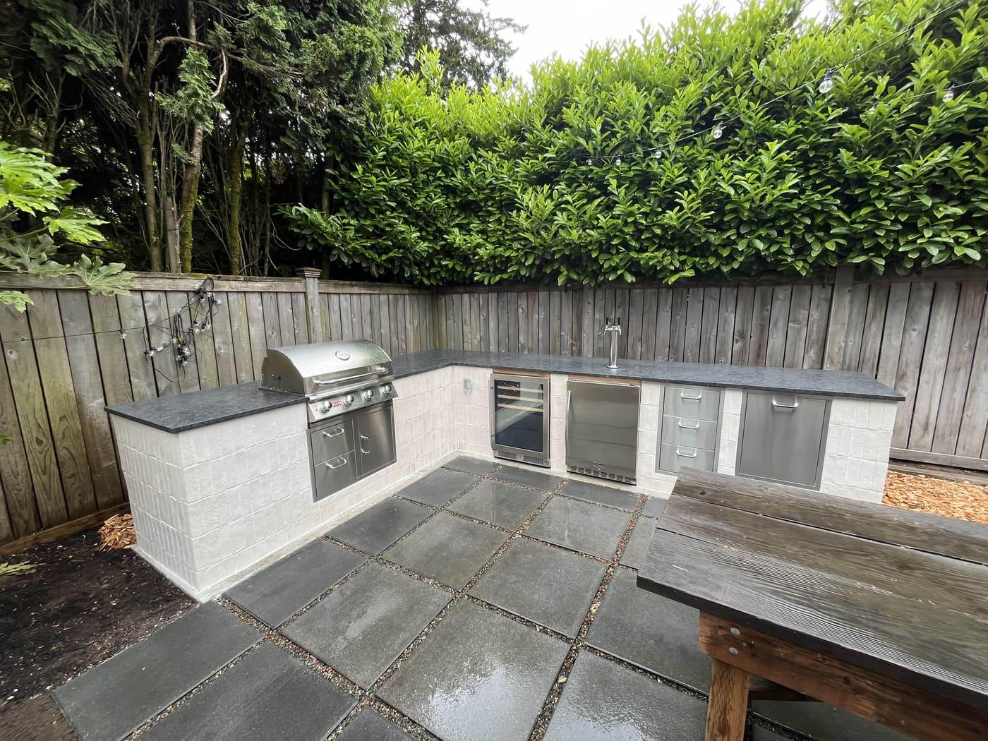 Custom outdoor kitchen with stone work in Greater Seattle