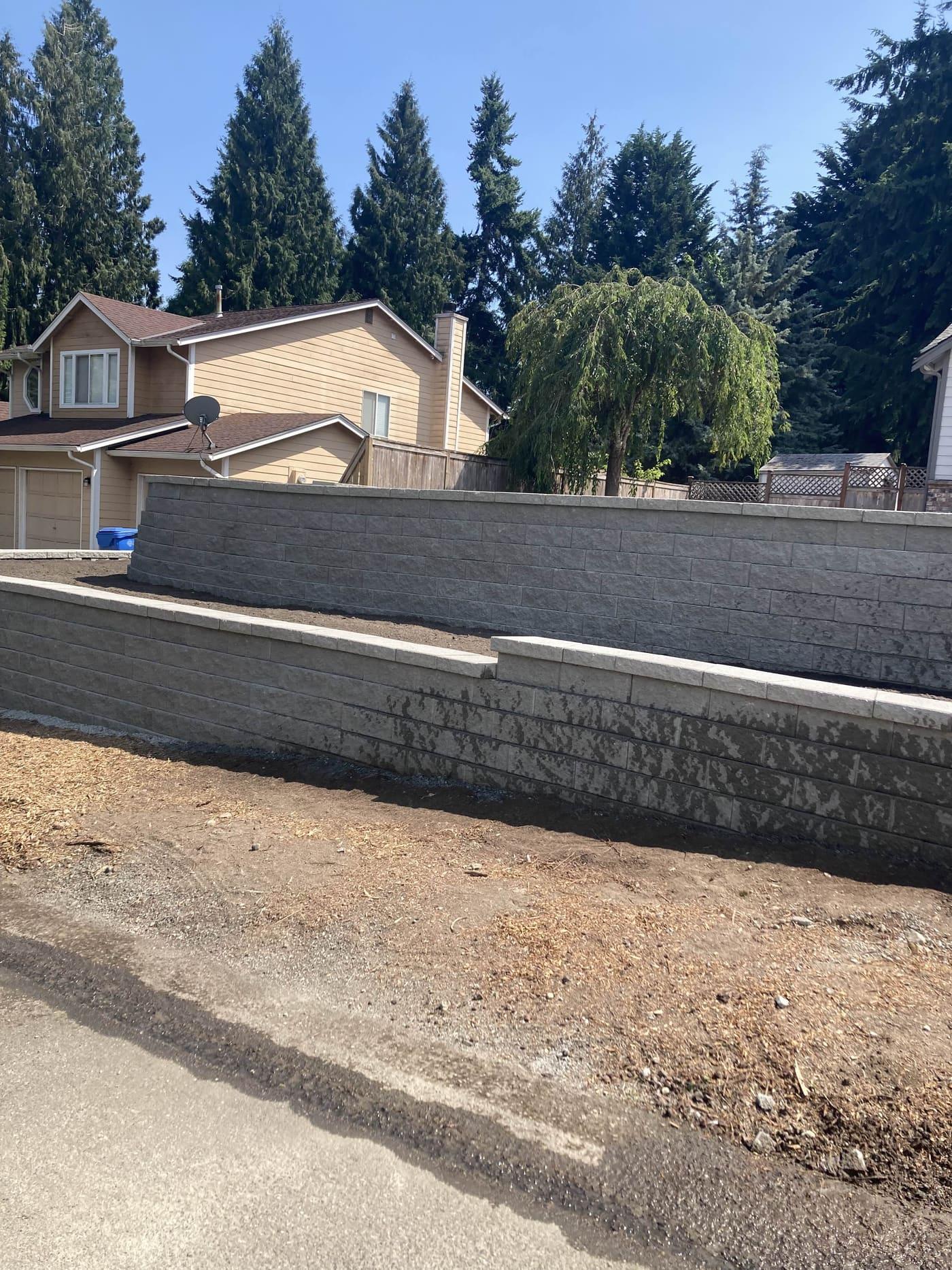 Stone retaining wall with drainage in Greater Seattle